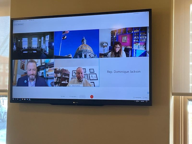 Grand County Richard Cimino is next to Grand Lake Mayor Steve Kudron on the big screen inside the House Energy and Environment Committee Room. 